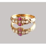 A late Victorian 18ct yellow gold ruby, pearl & diamond ring, with a small central diamond flanked