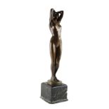 Property of a gentleman - an early 20th century patinated bronze figure of a standing female nude,