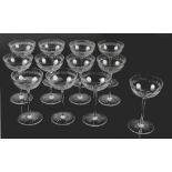 Property of a gentleman - a set of twelve glass champagne bowls with cut leaf banding (12) (see