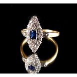 An early 20th century yellow gold sapphire & diamond ring, the cushion cut sapphire weighing