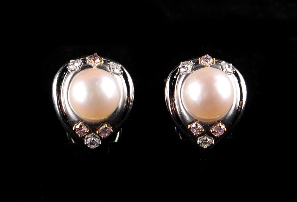 A pair of 18ct white gold pearl & pink diamond earrings, with clip fastenings, each set with a