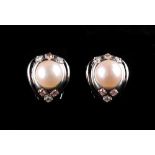 A pair of 18ct white gold pearl & pink diamond earrings, with clip fastenings, each set with a