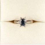Property of a lady - an 18ct white gold oval cut sapphire & diamond ring, with pierced shoulders,