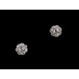 A pair of 18ct white gold diamond flowerhead cluster stud earrings, for pierced ears, each with