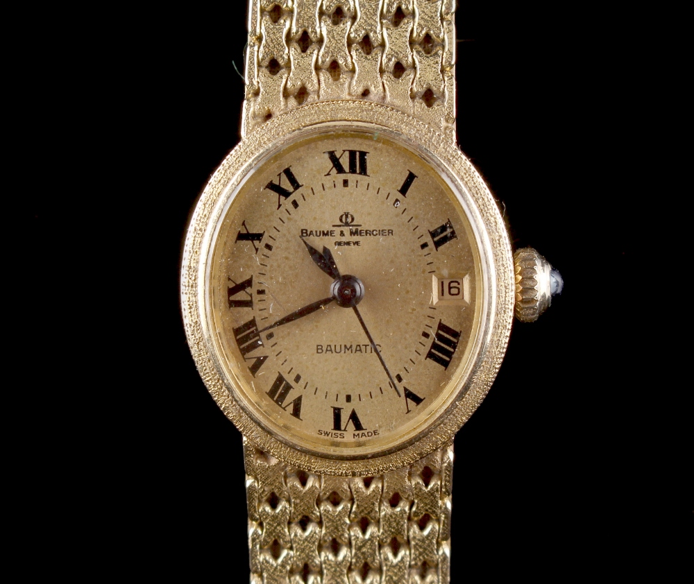 Property of a lady - a lady's Baume & Mercier 18ct yellow gold oval cased automatic wristwatch