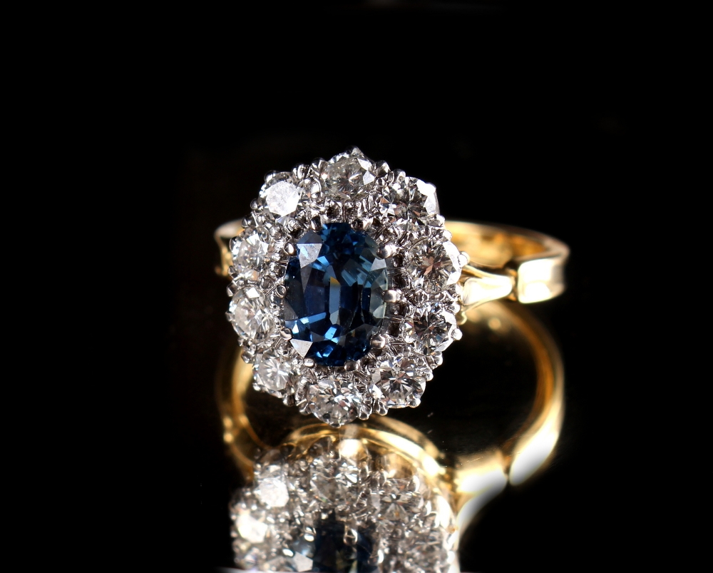 An 18ct yellow gold sapphire & diamond oval cluster ring, the oval cut sapphire weighing - Image 2 of 2
