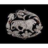 An early 20th century Belle Epoque diamond openwork brooch modelled as a striding lion suspended