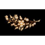 An early 20th century 15ct yellow gold & pearl floral spray brooch, 2.05ins. (5.2cms.) long,