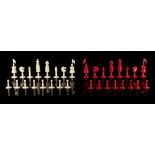 A private collection of chess sets - a 19th century English red stained & natural ivory chess set,