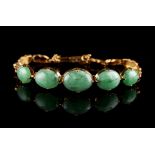 A certificated untreated jadeite link bracelet, with five graduated oval cabochon cut stones, the