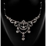 A very attractive Belle Epoque style platinum & diamond necklace, the largest diamond