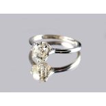 An unmarked white gold diamond solitaire ring, the oval cut diamond approximately 1.08 carats,