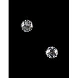A pair of faint blue diamond stud earrings, each round brilliant cut diamond in diamond set