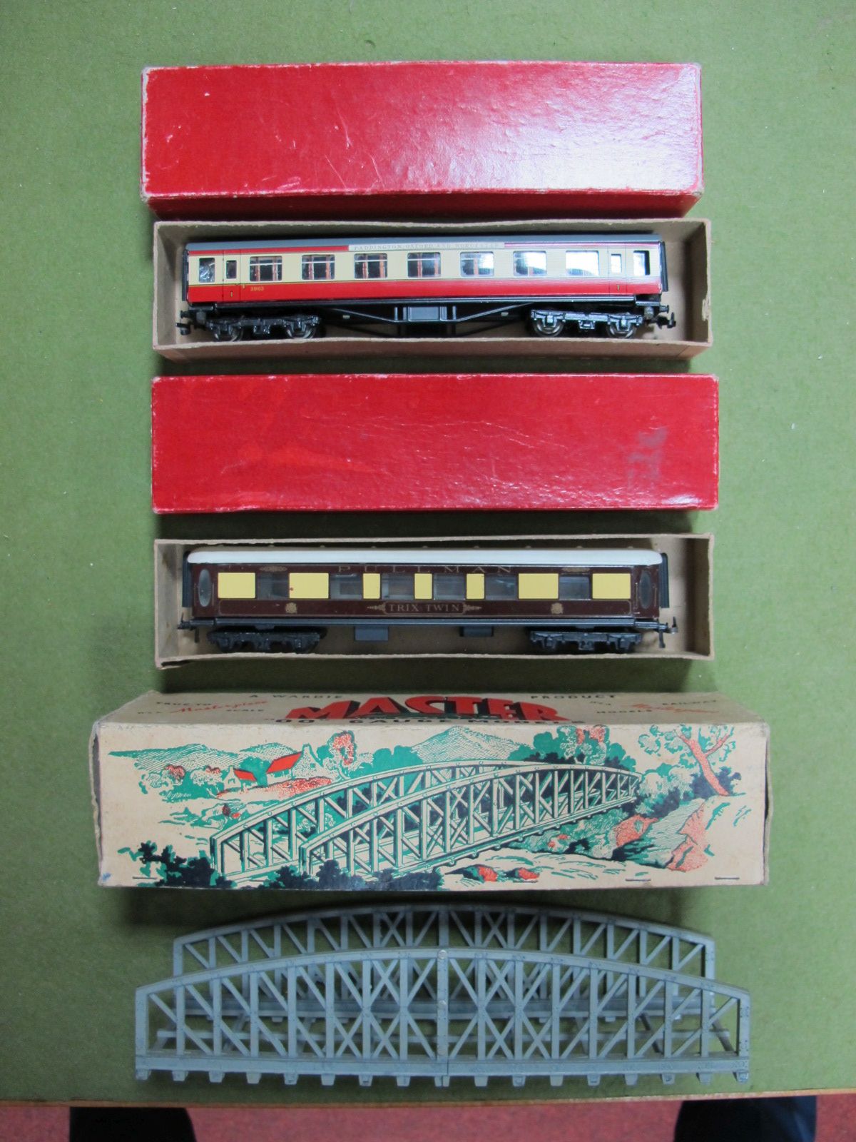 One Trix 'OO' Pullman Coach and one Trix 'OO' Blood and Custard Coach, 1st. Both boxed, plus a boxed