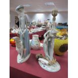 A Lladro Model of a Lady Walking a Dog, base impressed made in Spain, Lladro 4', height 40cm and a