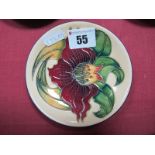 A Moorcroft Pottery Coaster, decorated with the 'Anna Lily' design by Nicola Slaney, shape 780/4,