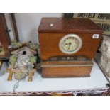 A Table Top Clocking in Machine by Time Records (Leeds) Ltd, circa 1920's in oak with oxidised