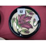 A Moorcroft Pottery Coaster, decorated with the 'Pulsatilla' design by Vicky Lovatt, shape 780/4,