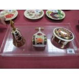 A Royal Crown Derby Imari Oval Jar and Cover, pattern 1128, an Imari model bell and a model garden