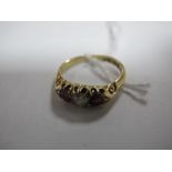 An 18ct Gold Diamond Set Ring, alternately claw set.