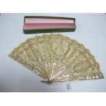 A Mid XX Century Fan with Studded Mother of Pearl Sticks, the highly decorative gauze highlighted