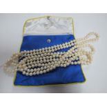 A Modern Long Single Strand Fresh Water Pearl Bead Necklace, of uniform design.