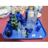 Blue Glass Eye Baths, poison and other bottles, etched glass water jug, etc:- One Tray