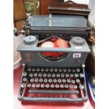 A XX Century Imperial Grey Typewriter.