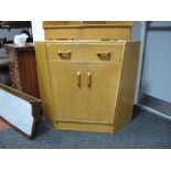 A G-Plan Light Oak Corner Desk Unit by E.Gomme, with single drawer and fall front over cupboard