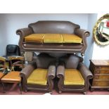 A 1930's Brown Leatherette Three Piece Lounge Suite, with studded sides and shaped backs on bun