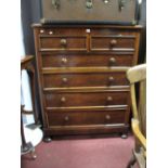 A XIX Century Mahogany Chest of Drawers, with two short drawers, four long drawers, on bun feet.