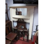 An Early XX Century White Painted Fireplace, with a central rectangular shaped mirror, over a bow