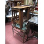 A Walnut Mahogany Nest of Tables; together with an early XX Century armchair, with a shaped top