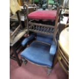 A XIX Century Mahogany Armchair, with upholstered back and seat, shaped arms, on turned legs;