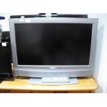 A Sony Bravia 26" Television, with remote control.