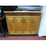 A Light Wood Four Drawer Cupboard, with upper single drawer, on castors.