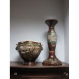 A XX Century Continental Pottery Jardiniere and Stand, with moulded decoration of cherubs playing