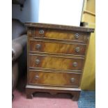 A Reprodux Bevan Funnel Mahogany Bachelors Chest, with fold over top, four graduated drawers on