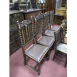 A Set of Four 1920's Oak Rail Back Dining Chairs, each with scroll cresting and barley twist