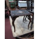 An Early XX Century Oak Stool, with thistle carving to serpentine top, on sabre legs, 44cm high.