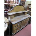 A XIX Century Pine Dresser, having glass handles to cupboard door, six upper and six lower