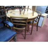 A G Plan Teak Extending Dining Table, circular top with concealed leaf, with four matching dining