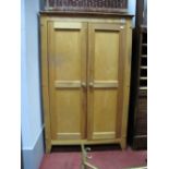 A Light Wood Cupboard, with inner shelves, 77cm wide.