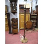 A 1920's Walnut Standard Lamp, with heptagonal body and stepped circular base.