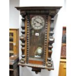 A XIX Century Walnut Cased Viennese Wall Clock, with black Roman numerals to white enamel dial.