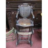 An Early XX Century Folding Child's High Chair, plus chair, with a shaped top rail, pierced seat