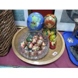 A Quantity of Russian Dolls, eggs, glass bowl, shallow wooden fruit bowl.