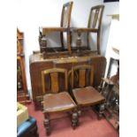 A 1920's Oak Sideboard and Four Chairs, all on heavy fluted legs.