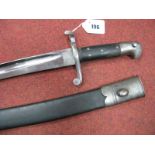 An 1856 Sword Bayonet For The 2 Band Enfield Rifle, in black leather scabbard, excellent condition.