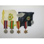 WWII Group of Four Medals, consisting of 39/45 Star, Africa Star, Defence and War Medal. A white